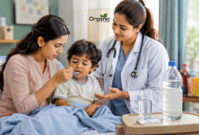 Child vomiting repeatedly: Mother giving ORS to a child with repeated vomiting while a pediatric doctor explains hydration